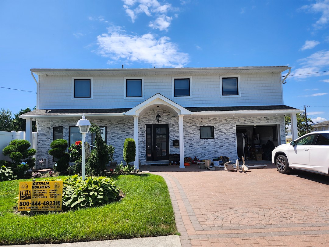 House destroyed by fire get a new Natural Stone, Anderson Windows and Shake Siding make over In Oceanside, (Long Island) NY